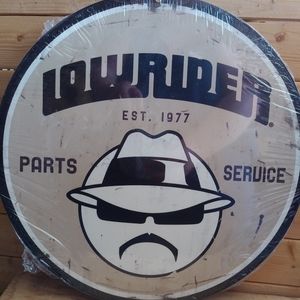 Lowrider round metal sign. 14"